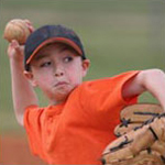 young boy playing baseball