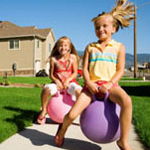 girls playing on sidewalk