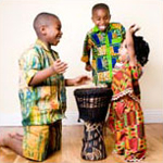 three children playing drums