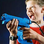boy holding a laser tag gun
