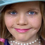 girl wearing Mardi Gras beads