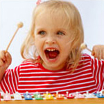 girl playing xylophone