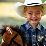 Little boy dressed as cowboy