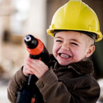 boy wearing construction hat