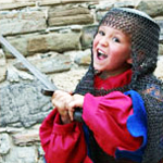 young boy wearing a knight costume