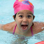 happy girl swimming