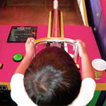 Boy playing video game at an arcade