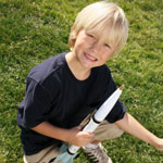 boy playing with model rocket